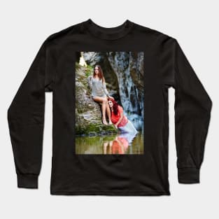 Two beautiful young women leaning on rocks beside a river Long Sleeve T-Shirt